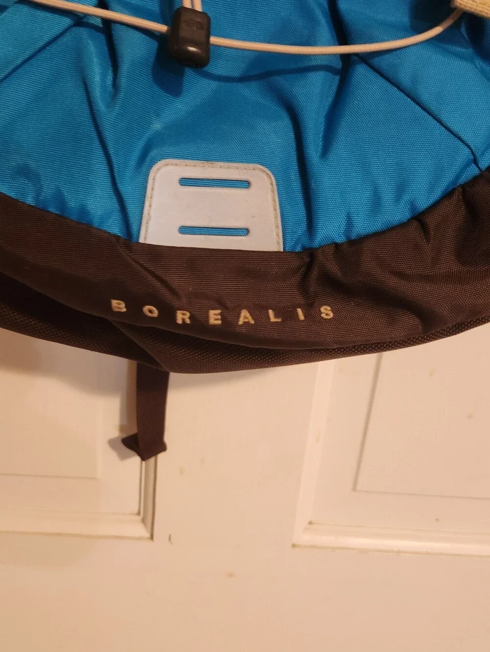 The North Face Borealis backpack in turquoise blue and brown